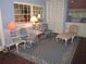 Inviting sun room with lounge seating and ample natural light at 2143 Wrens Way, Clearwater, FL 33764