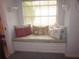 Charming window seat with decorative pillows, a cozy reading nook at 2143 Wrens Way, Clearwater, FL 33764