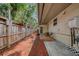 A quaint backyard featuring a privacy fence, a table with chairs, and a concrete patio at 2316 Lancaster Dr, Clearwater, FL 33764