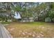 Charming single story home featuring mature trees, a detached garage, and storage shed on a large lot at 2316 Lancaster Dr, Clearwater, FL 33764