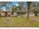 Well maintained single story home with an attached garage, mature trees and updated landscaping at 2316 Lancaster Dr, Clearwater, FL 33764