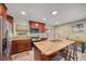 Well-appointed kitchen with stainless steel appliances, center island, and ample counter space at 2316 Lancaster Dr, Clearwater, FL 33764