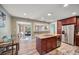 Open kitchen featuring a center island, stainless appliances, and a seamless flow to the living areas at 2316 Lancaster Dr, Clearwater, FL 33764