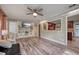 Inviting living room boasting a stylish entertainment center and a view into the kitchen at 2316 Lancaster Dr, Clearwater, FL 33764