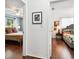 Picture captures the doorways into two distinct bedrooms featuring hardwood floors and cozy decor at 2560 51St N St, St Petersburg, FL 33710