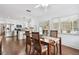 Dining room featuring a wooden table with chairs, leading to the kitchen area with stainless steel appliances at 2560 51St N St, St Petersburg, FL 33710