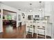 Bright kitchen featuring an island with seating, stainless steel appliances, and hardwood flooring at 2560 51St N St, St Petersburg, FL 33710