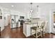 Stylish kitchen boasting white cabinetry, stainless steel appliances, and a functional island at 2560 51St N St, St Petersburg, FL 33710