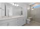 Bathroom features a double sink vanity and tiled shower with a glass enclosure at 27132 Capri Shores Cir, Englewood, FL 34223