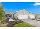 Beautiful single Gathering home with a neutral paint scheme, 2-car garage, and manicured landscaping at 27132 Capri Shores Cir, Englewood, FL 34223