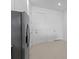 Modern kitchen appliances and fixtures, plus a view to the doors separating the house from the outside world at 27132 Capri Shores Cir, Englewood, FL 34223
