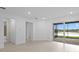 Open living space with sliding glass doors offering beautiful water views at 27132 Capri Shores Cir, Englewood, FL 34223