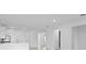 Open-concept living area boasts lots of natural light and neutral finishes at 27132 Capri Shores Cir, Englewood, FL 34223