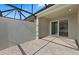 Relaxing covered patio with stylish brick flooring and a sliding glass door to the home at 27132 Capri Shores Cir, Englewood, FL 34223