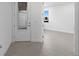 Bright entryway featuring a decorative glass door and tile flooring at 27136 Capri Shores Cir, Englewood, FL 34223