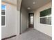 Welcoming front porch with a decorative glass door and tiled floor at 27136 Capri Shores Cir, Englewood, FL 34223