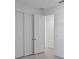 Hallway closet has bi-fold doors and is freshly painted, with contemporary recessed lighting and a smooth ceiling at 27136 Capri Shores Cir, Englewood, FL 34223