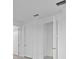 Hallway with neutral walls and doors at 27136 Capri Shores Cir, Englewood, FL 34223