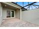 Screened lanai with pavers, recessed lights, ceiling fan, and sliding door access to the indoors at 27136 Capri Shores Cir, Englewood, FL 34223
