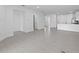 Open-concept living area with tile flooring throughout and plenty of natural light at 27136 Capri Shores Cir, Englewood, FL 34223