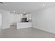 Spacious living area with an open floor plan leading to the kitchen and other living areas at 27136 Capri Shores Cir, Englewood, FL 34223