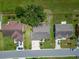 Aerial view of a single-Gathering home with a three car garage and lush landscaping surrounded by green space at 2719 Wilder Trace Ct, Plant City, FL 33566