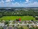 Beautifully landscaped property featuring a backyard pool and a large green space, offering privacy and space at 2719 Wilder Trace Ct, Plant City, FL 33566