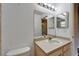 Bathroom featuring a vanity, mirror, toilet, sink, and tiled shower at 2719 Wilder Trace Ct, Plant City, FL 33566
