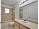 Bathroom featuring a single sink vanity, combination tub and shower with tile surround, and neutral finishes at 2719 Wilder Trace Ct, Plant City, FL 33566