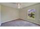 Bedroom featuring carpet, a window with natural light, and neutral walls and a ceiling fan at 2719 Wilder Trace Ct, Plant City, FL 33566