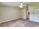 Spacious bedroom with neutral paint, carpet flooring and a ceiling fan at 2719 Wilder Trace Ct, Plant City, FL 33566