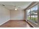 Bedroom with wood floors and a large window at 2719 Wilder Trace Ct, Plant City, FL 33566