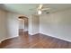 Bedroom with wood floors and arched doorway at 2719 Wilder Trace Ct, Plant City, FL 33566