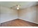 Bedroom features wood floors and a ceiling fan at 2719 Wilder Trace Ct, Plant City, FL 33566