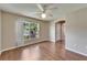 Bedroom features wood floors and a large window at 2719 Wilder Trace Ct, Plant City, FL 33566