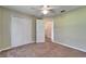 Bedroom with closet featuring doors, natural light from the window, and access to other rooms at 2719 Wilder Trace Ct, Plant City, FL 33566