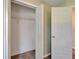 An open closet with shelving and carpet flooring, with a view into an adjacent room through the door at 2719 Wilder Trace Ct, Plant City, FL 33566