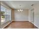 Dining room features wood floors and a chandelier at 2719 Wilder Trace Ct, Plant City, FL 33566