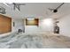 Spacious garage with concrete floor and peg boards on the walls at 2719 Wilder Trace Ct, Plant City, FL 33566