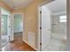 Hallway view showing bathroom and carpeted room at 2719 Wilder Trace Ct, Plant City, FL 33566