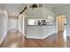 Open-concept living area with modern flooring and a partial kitchen view at 2719 Wilder Trace Ct, Plant City, FL 33566
