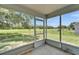 An inviting screened patio with a view of a fenced backyard at 2719 Wilder Trace Ct, Plant City, FL 33566
