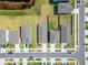 Aerial view of charming homes and a pond in this attractive neighborhood at 3186 Oyster Cove St, Wimauma, FL 33598