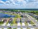 Aerial view showcasing the lakeside community's convenient location near expansive greenery at 3186 Oyster Cove St, Wimauma, FL 33598