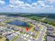 Aerial view of a lakeside community with easy access to surrounding farmland at 3186 Oyster Cove St, Wimauma, FL 33598