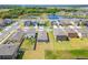Wide aerial shot featuring modern homes and a scenic lake at 3186 Oyster Cove St, Wimauma, FL 33598