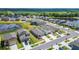 Aerial view highlighting the lakeside community's picturesque location by a pond and farmlands at 3186 Oyster Cove St, Wimauma, FL 33598