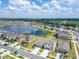 Aerial view showcasing the lakeside community's location near expansive green space at 3186 Oyster Cove St, Wimauma, FL 33598