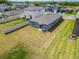 Backyard view of home with vinyl fence, grass, and patio at 3186 Oyster Cove St, Wimauma, FL 33598