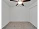 Bedroom with neutral carpet, ceiling fan, and closet with bi-fold doors at 3186 Oyster Cove St, Wimauma, FL 33598